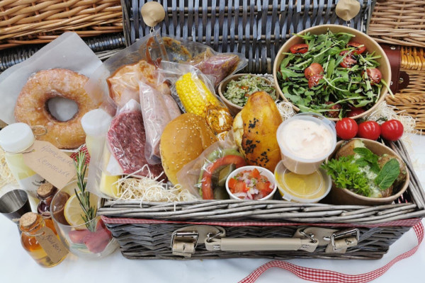 BBQ hamper filled with meats, salads, breads and more