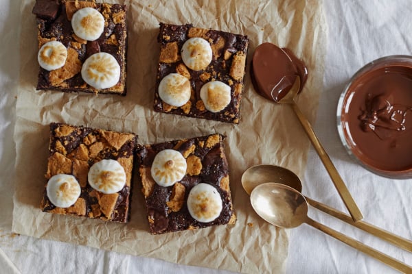Four smores flavoured brownies on greaseproof paper