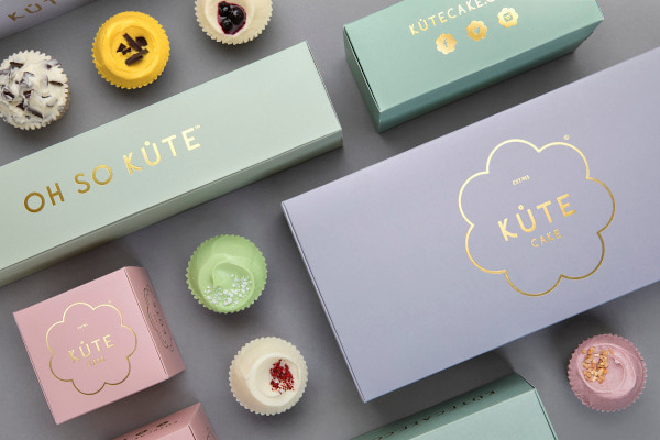 Pastel coloured boxes and cupcakes