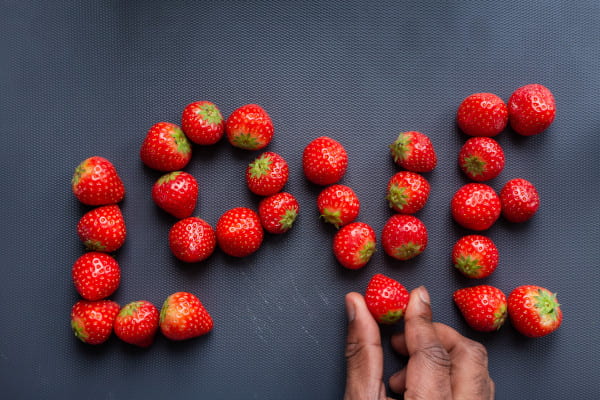 Strawberries spelling out the word 'Love'