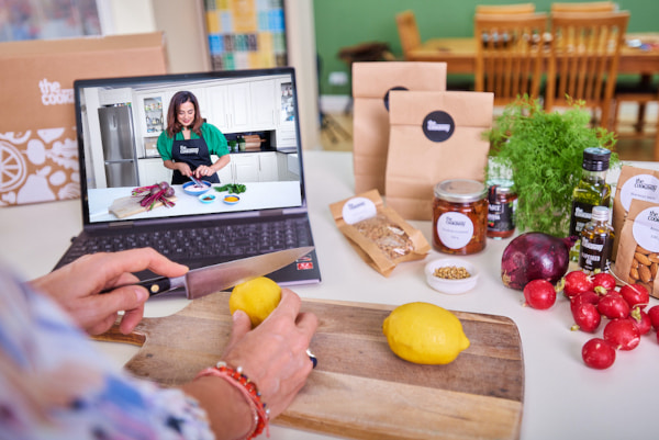 Person taking part in an online cooking course on their laptop