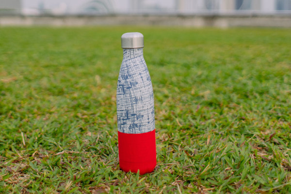 Reusable water bottle on grass