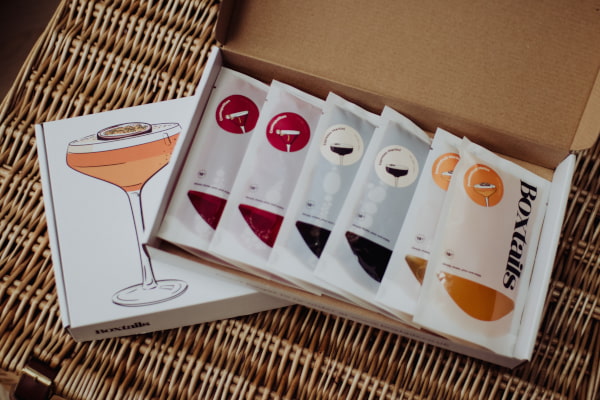 cardboard box filled with cocktail sachets