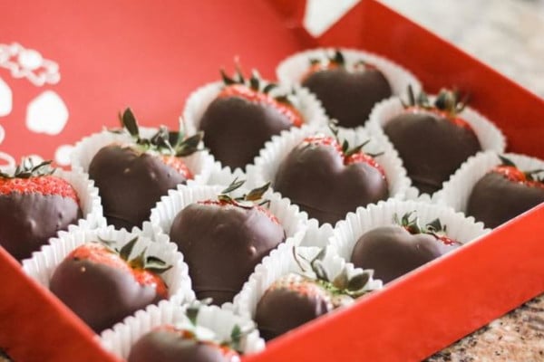 red box filled with chocolate dipped strawberries