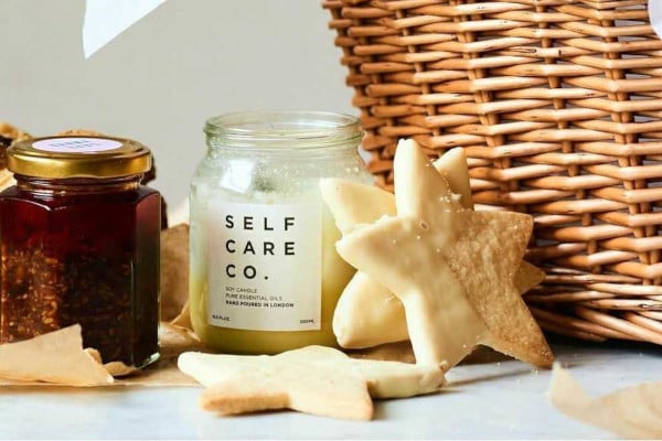 Wicker basket, candle, star cookie, and chutney